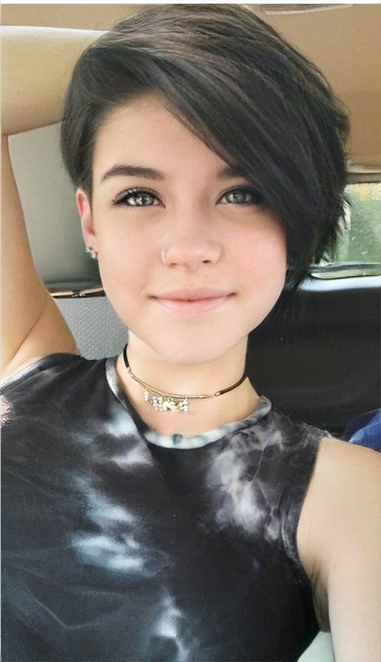 A textured undercut pixie, short faded pixie haircut, or messy pixie with undercut